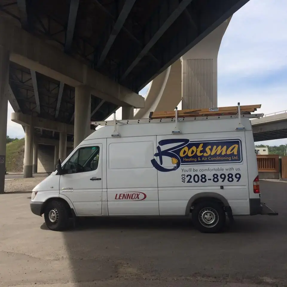 Tim Bootsma explaining Calgary HVAC system to customer - Educational service approach